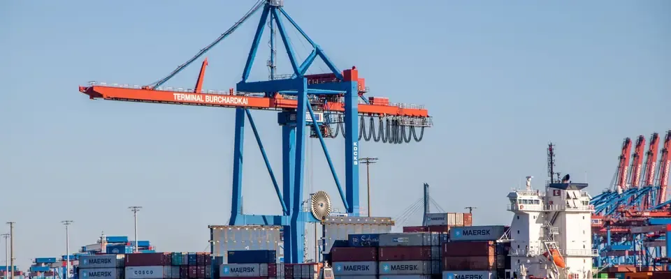 Container cranes and ship at a European port